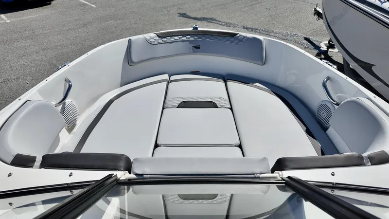 Slide: The Image of 2025 Bayliner M17 boat interior with cushioned seating and sleek design. - 4