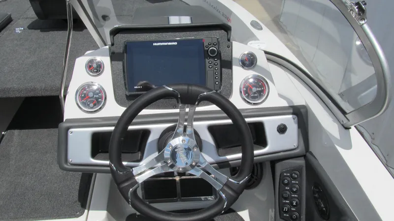Slide: The Image of Ranger 212LS 2025 boat dashboard with steering wheel and navigation system. - 6