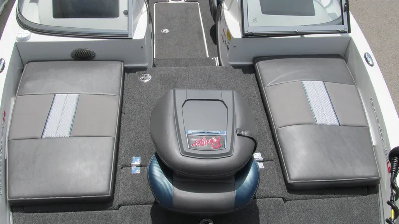 Slide: The Image of 2025 Ranger 212LS boat interior with cushioned seating and sleek design. - 9