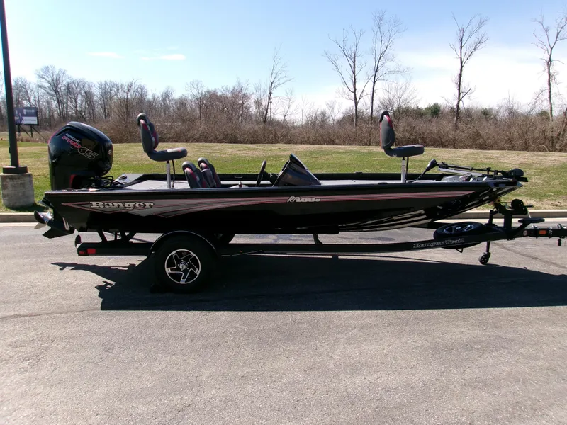 The Image of 2025 Ranger RT188C fishing boat on trailer, parked outdoors. - 0