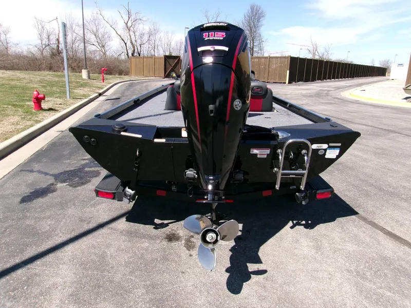 Slide: The Image of 2025 Ranger RT188C boat with powerful outboard motor, parked on a sunny day. - 1