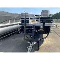 The Image of 2025 Ranger Reata 223FC pontoon boat on trailer, parked outdoors. - 1