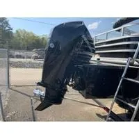 Slide: The Image of 2025 Ranger Reata 223FC boat engine, black, parked outdoors near a fence. - 10