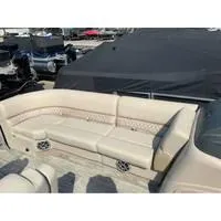 Slide: The Image of 2025 Ranger Reata 223FC boat interior with beige seating and speaker system. - 12