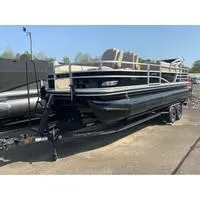 Slide: The Image of 2025 Ranger Reata 223FC pontoon boat on trailer, parked outdoors. - 3