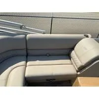 Slide: The Image of 2025 Ranger Reata 223FC boat interior with gray cushioned seating. - 7