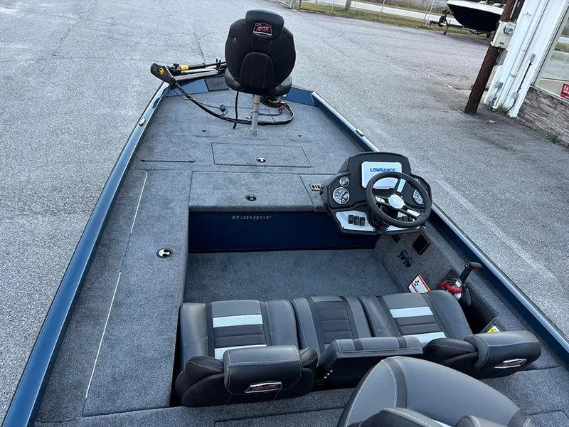 Slide: The Image of 2025 Ranger RT178C fishing boat interior with steering console and seating. - 10
