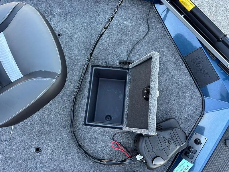 Slide: The Image of 2025 Ranger RT178C boat interior with storage compartment and seat. - 12