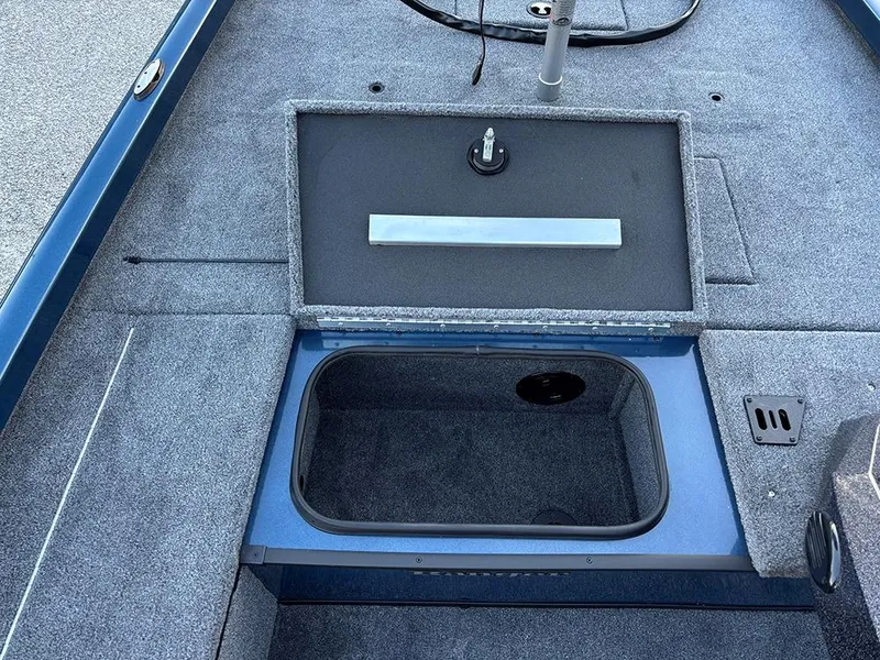Slide: The Image of 2025 Ranger RT178C boat storage compartment with open lid, showcasing interior space. - 14