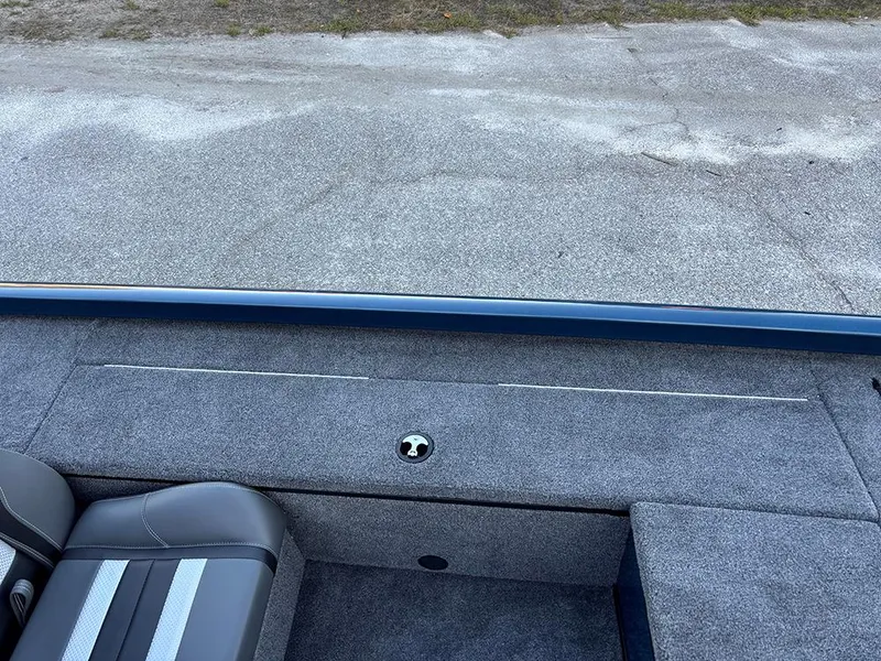 Slide: The Image of 2025 Ranger RT178C boat interior with gray carpet and seating. - 15