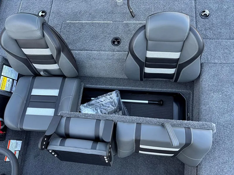 Slide: The Image of 2025 Ranger RT178C boat interior with gray seats and storage compartment. - 18
