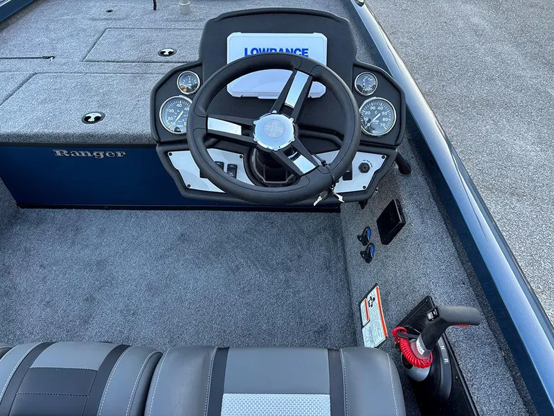 Slide: The Image of 2025 Ranger RT178C boat cockpit with steering wheel and Lowrance display. - 20