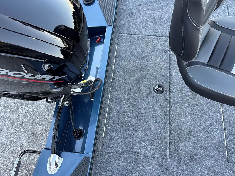 Slide: The Image of 2025 Ranger RT178C boat interior with Mercury engine and seating. - 23