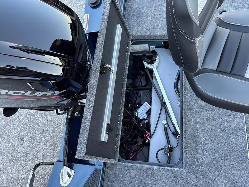 Slide: The Image of 2025 Ranger RT178C boat storage compartment with Mercury engine and seating. - 24