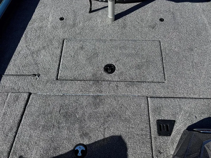 Slide: The Image of 2025 Ranger RT178C boat deck with storage compartments and gray carpeting. - 26