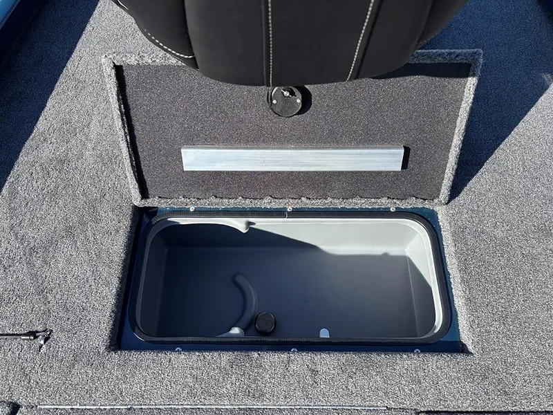 Slide: The Image of 2025 Ranger RT178C boat storage compartment with open lid. - 28