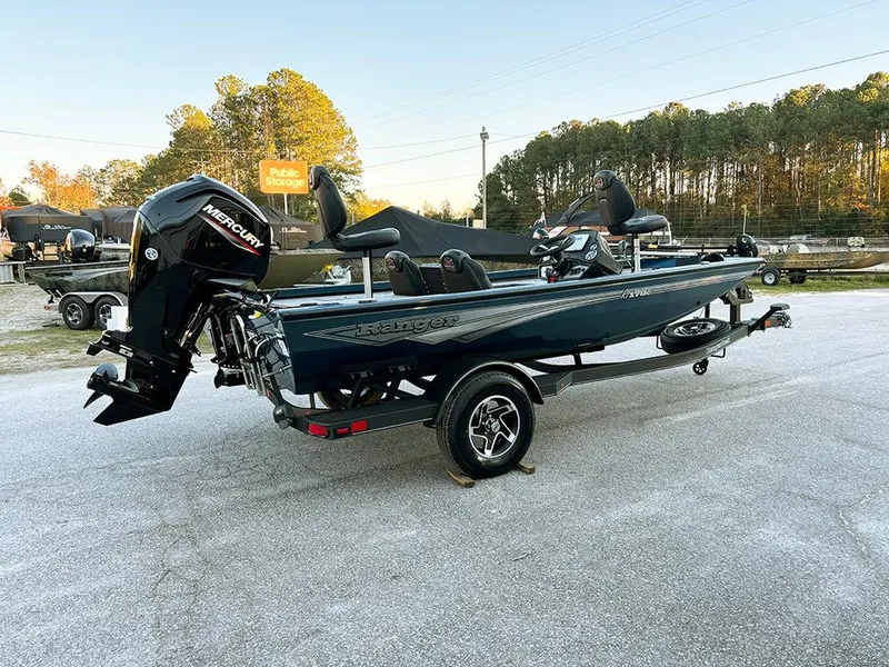 Slide: The Image of 2025 Ranger RT178C fishing boat with Mercury engine, parked outdoors. - 6