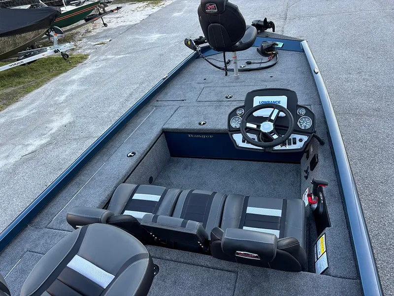 Slide: The Image of 2025 Ranger RT178C fishing boat interior with steering console and seating. - 9