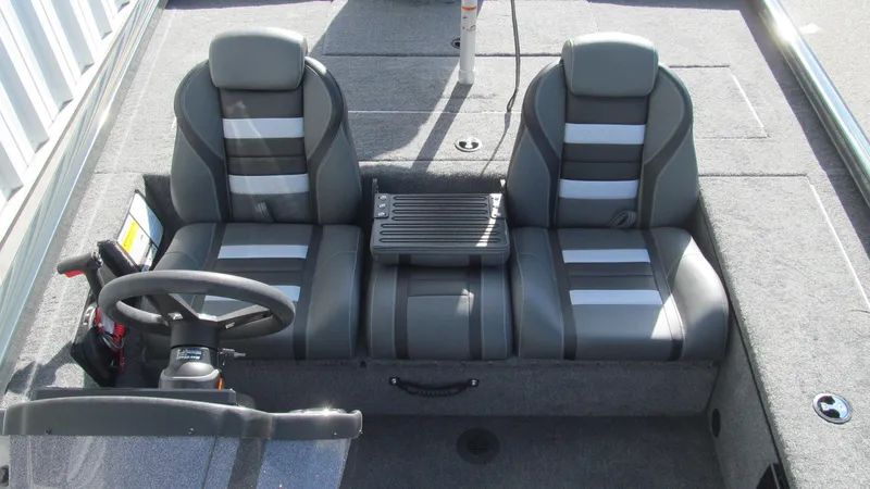 Slide: The Image of 2025 Ranger RT188C boat interior with dual seats and steering wheel. - 10