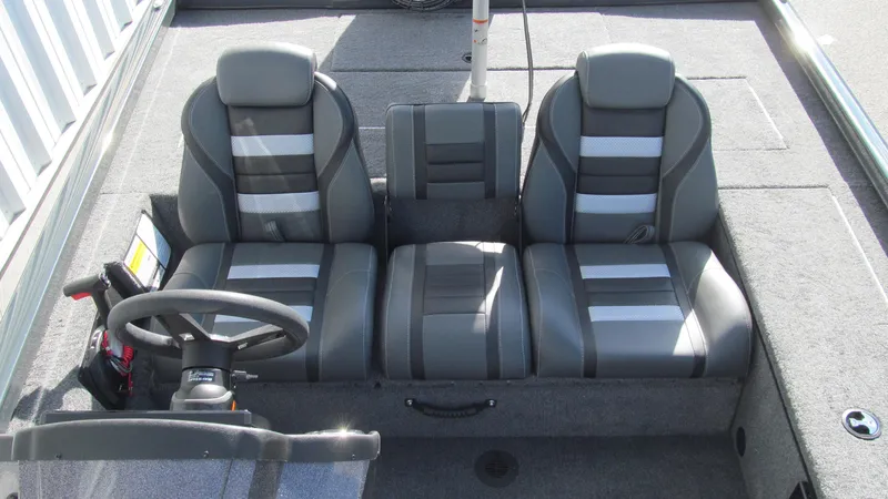 Slide: The Image of 2025 Ranger RT188C boat interior with three gray seats and steering wheel. - 11