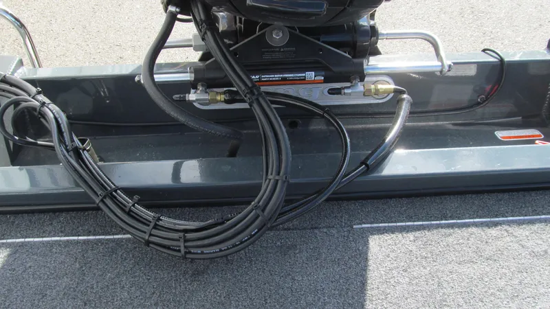 Slide: The Image of 2025 Ranger RT188C boat wiring and motor components close-up. - 13