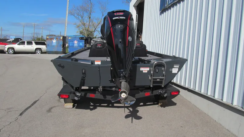 Slide: The Image of 2025 Ranger RT188C boat parked outside a building. - 4