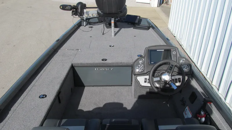 Slide: The Image of 2025 Ranger RT188C boat interior with steering wheel and control panel. - 5