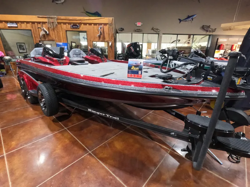 The Image of 2025 Ranger Z521 boat displayed indoors, featuring a sleek red design and advanced equipment. - 0