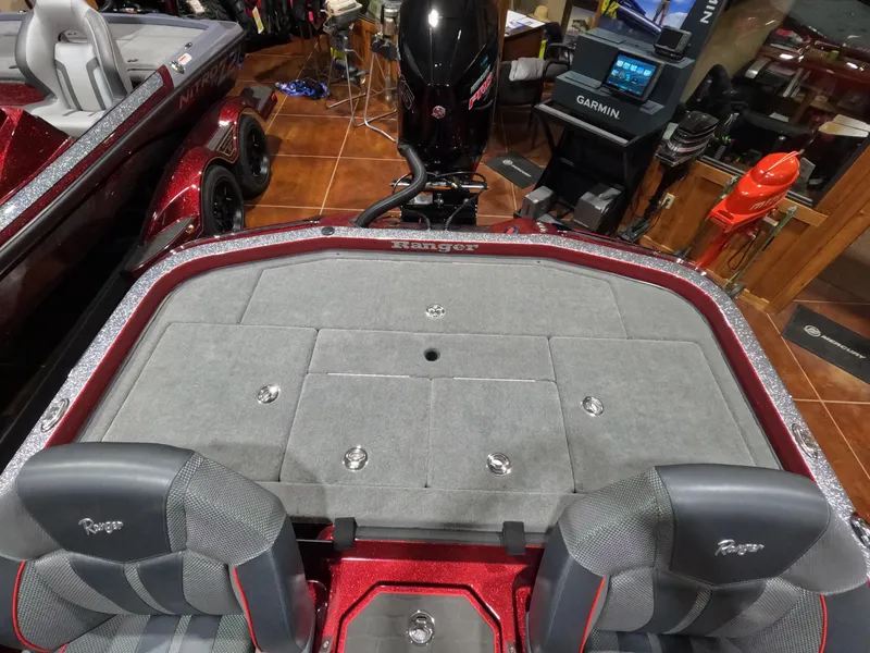 Slide: The Image of 2025 Ranger Z521 boat interior with gray seating and Garmin equipment. - 4