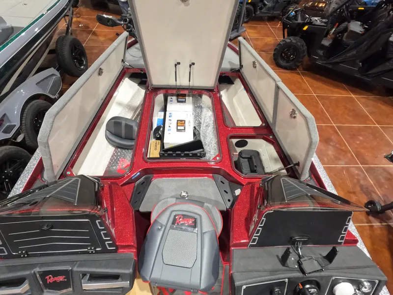 Slide: The Image of 2025 Ranger Z521 boat interior with open storage compartments and seating. - 6