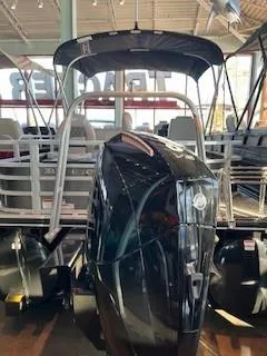 Slide: The Image of 2025 Ranger Reata 223F boat with outboard motor in showroom. - 3