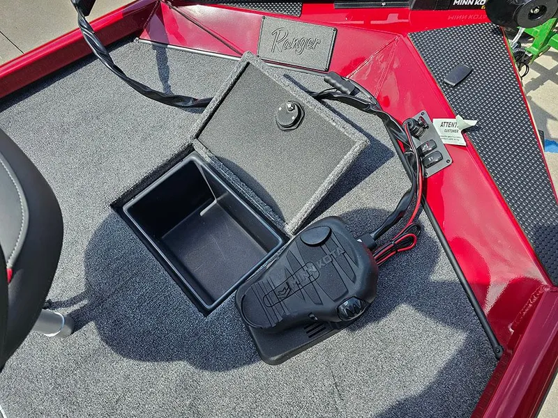 Slide: The Image of 2025 Ranger RT178C boat deck with storage compartment and foot pedal. - 16