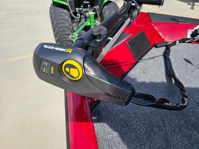 Slide: The Image of Minn Kota trolling motor on 2025 Ranger RT178C boat, red deck, outdoor setting. - 17