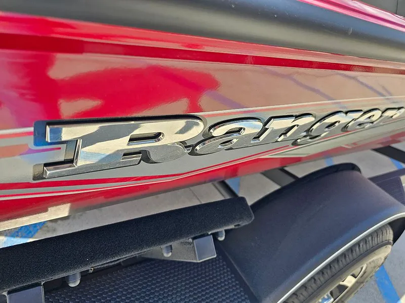 Slide: The Image of 2025 Ranger RT178C boat, red exterior, close-up of logo and trailer. - 25