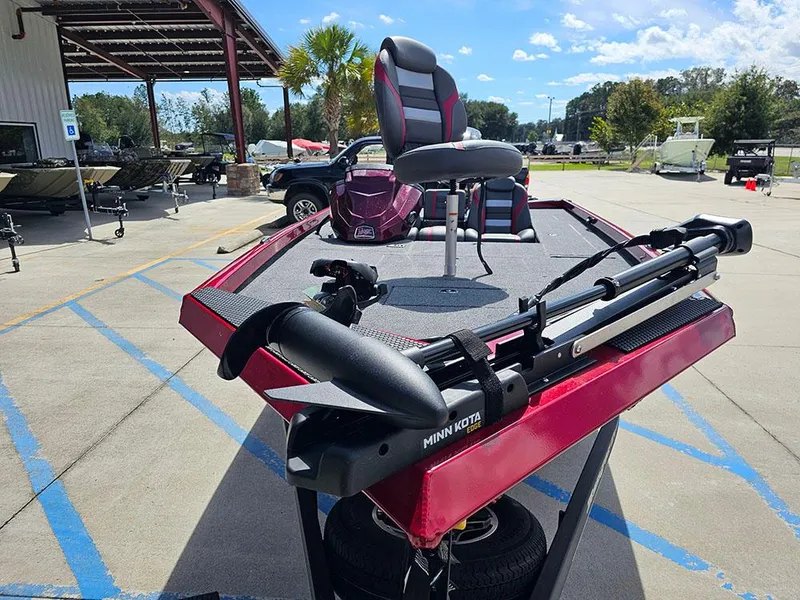 Slide: The Image of 2025 Ranger RT178C boat with Minn Kota trolling motor, parked outdoors on a sunny day. - 4