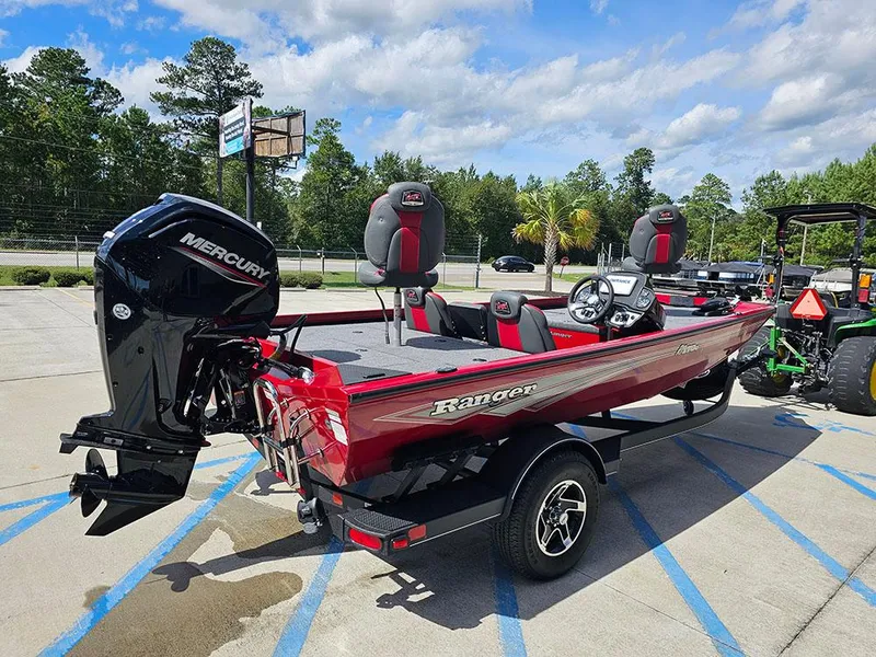 Slide: The Image of 2025 Ranger RT178C boat with Mercury engine, parked outdoors on a sunny day. - 7