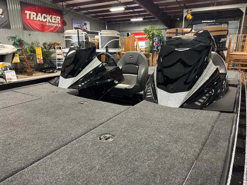 Slide: The Image of 2025 Triton 21XP Patriot boat interior in showroom, featuring sleek design and comfortable seating. - 4