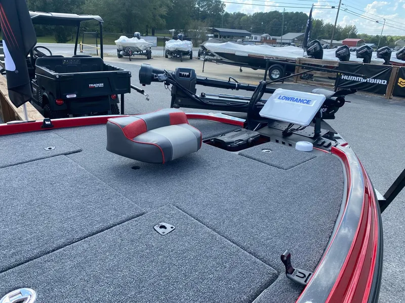 Slide: The Image of 2025 Triton 21XP Patriot boat deck with Lowrance electronics and seating. - 4