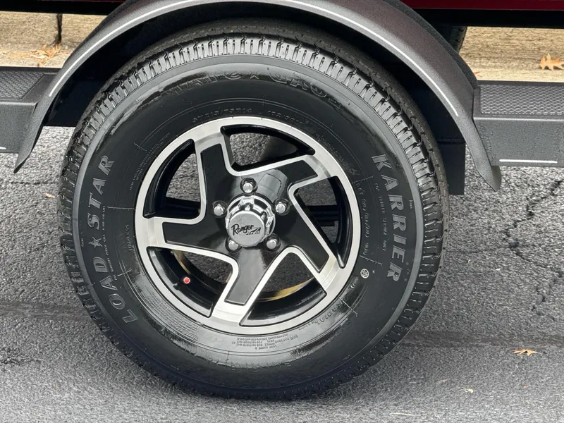 Slide: The Image of 2025 Ranger RT178C wheel with Loadstar Karrier tire on asphalt. - 11