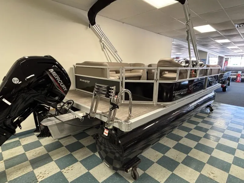 Slide: The Image of 2025 Ranger 200C pontoon boat with Mercury engine in showroom. - 1