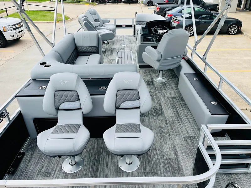 Slide: The Image of 2025 Ranger Reata 223FC pontoon boat with luxurious seating and modern design. - 10
