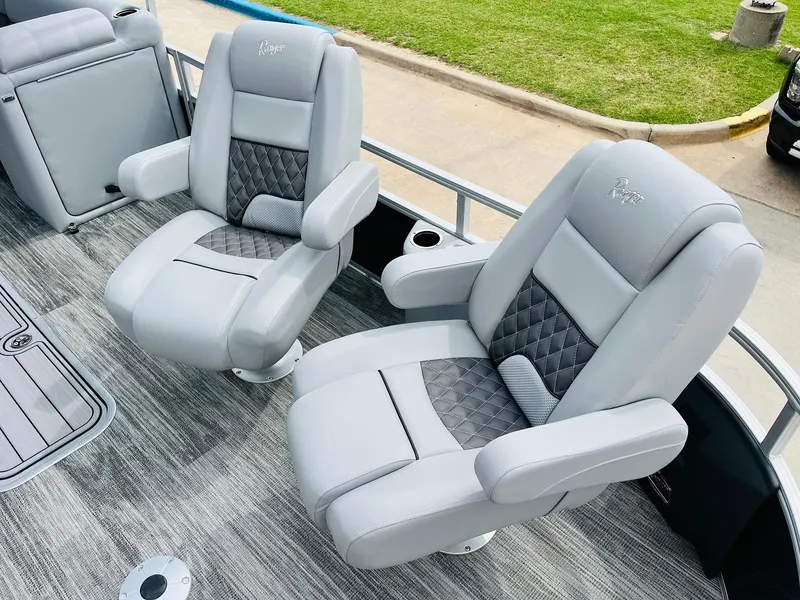 Slide: The Image of 2025 Ranger Reata 223FC boat seats with gray upholstery and diamond-patterned accents. - 13
