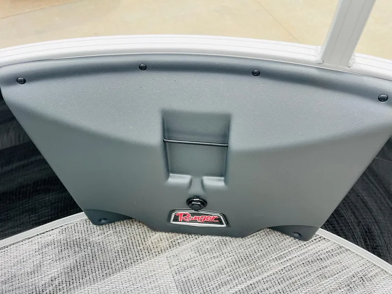 Slide: The Image of 2025 Ranger Reata 223FC boat interior detail with logo and textured flooring. - 14