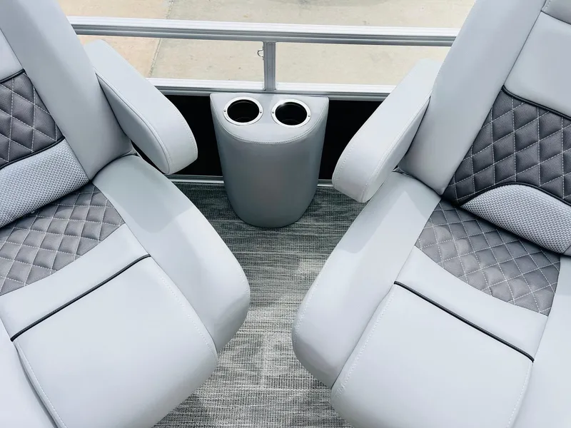 Slide: The Image of 2025 Ranger Reata 223FC boat seats with cup holders, featuring modern gray upholstery. - 15
