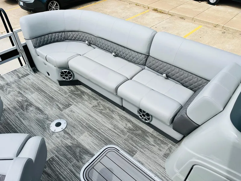 Slide: The Image of 2025 Ranger Reata 223FC boat interior with gray seating and modern design. - 16