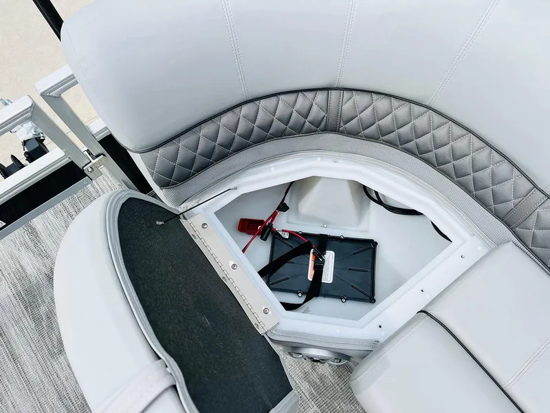 Slide: The Image of 2025 Ranger Reata 223FC boat seat storage with battery compartment. - 18