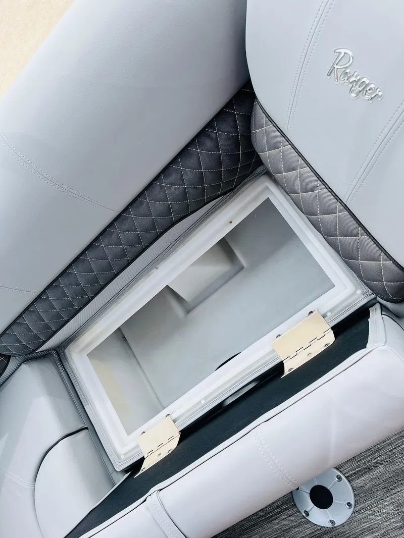 Slide: The Image of 2025 Ranger Reata 223FC boat seat with built-in storage compartment. - 24
