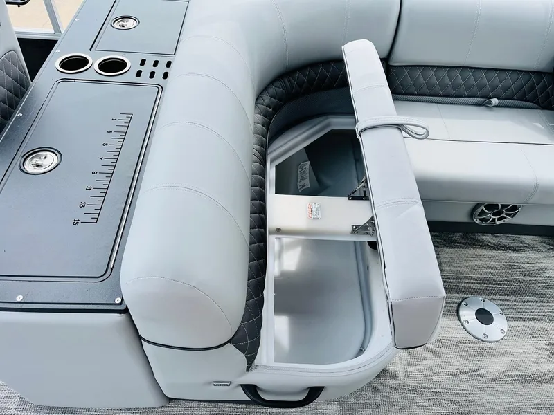 Slide: The Image of 2025 Ranger Reata 223FC boat interior with storage compartment and seating. - 25