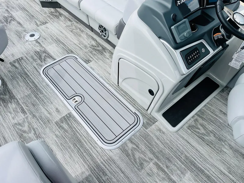 Slide: The Image of 2025 Ranger Reata 223FC boat interior with modern console and sleek flooring design. - 26