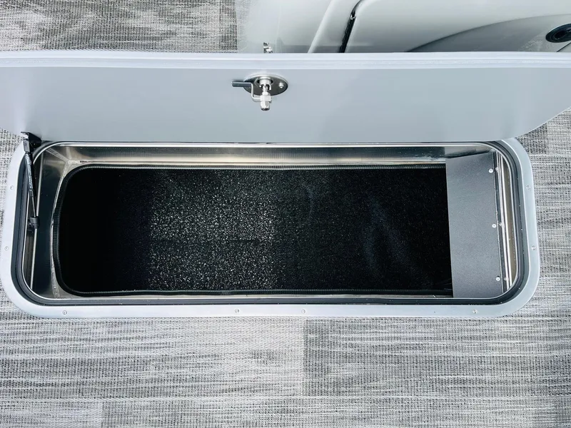 Slide: The Image of Open storage compartment in 2025 Ranger Reata 223FC boat. - 28
